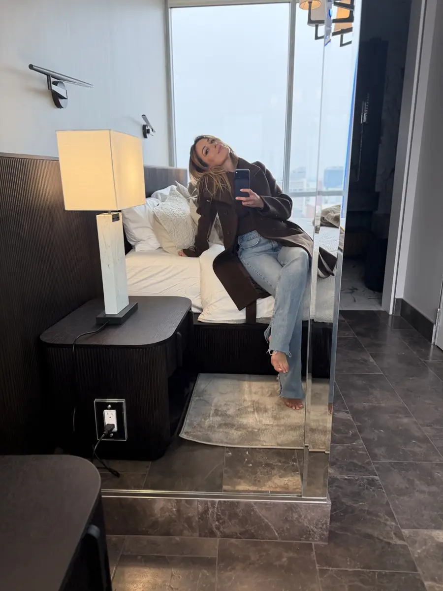 Jessica in a finished bedroom during a project walkthrough
